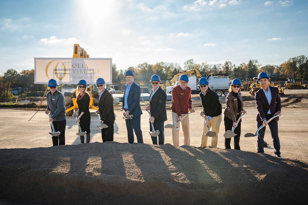 The team pictured shoveling dirt